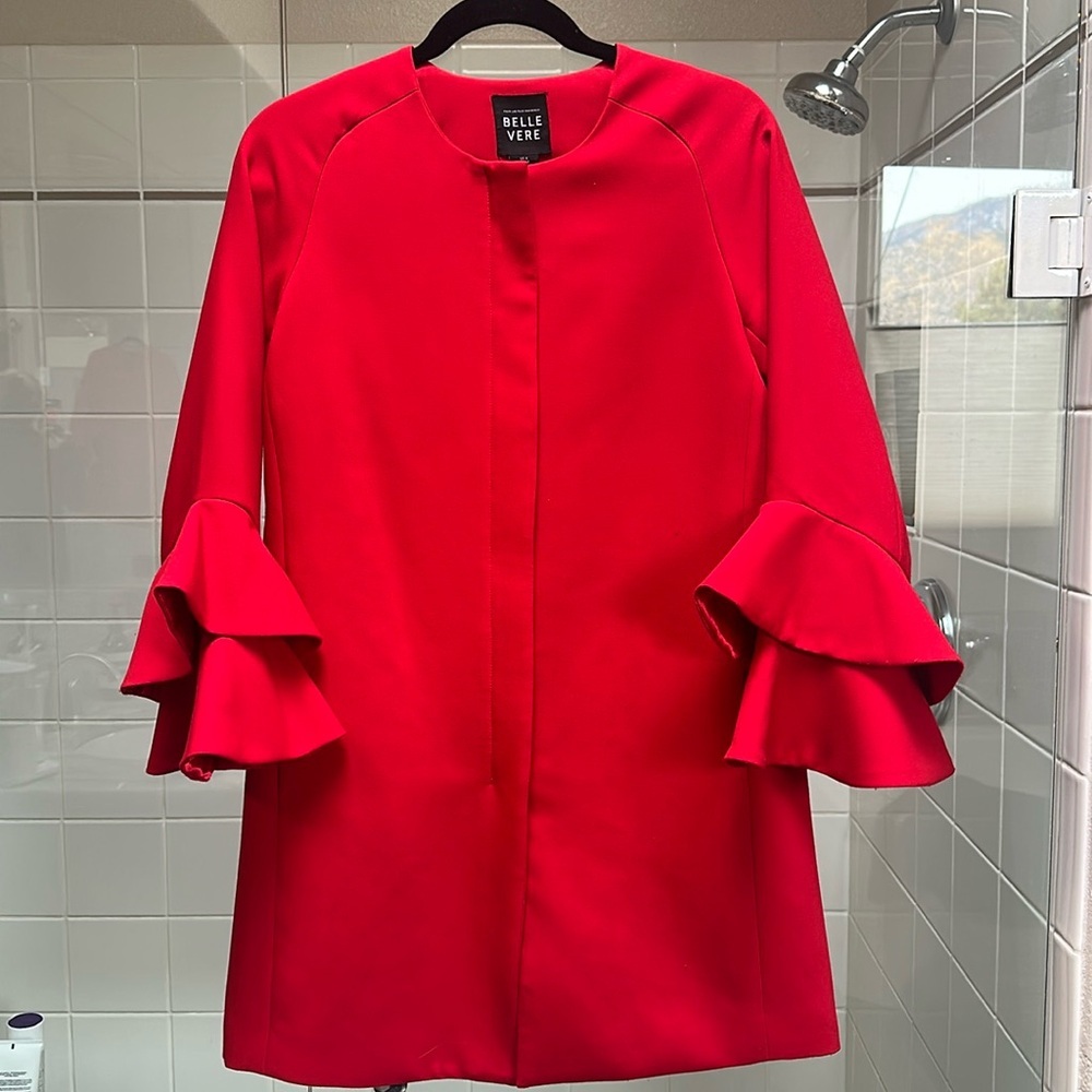 Red Coat. Zips up front with bell sleeves.